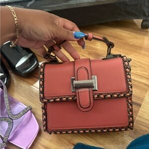 Chic Red Handbag with Chain Detail
